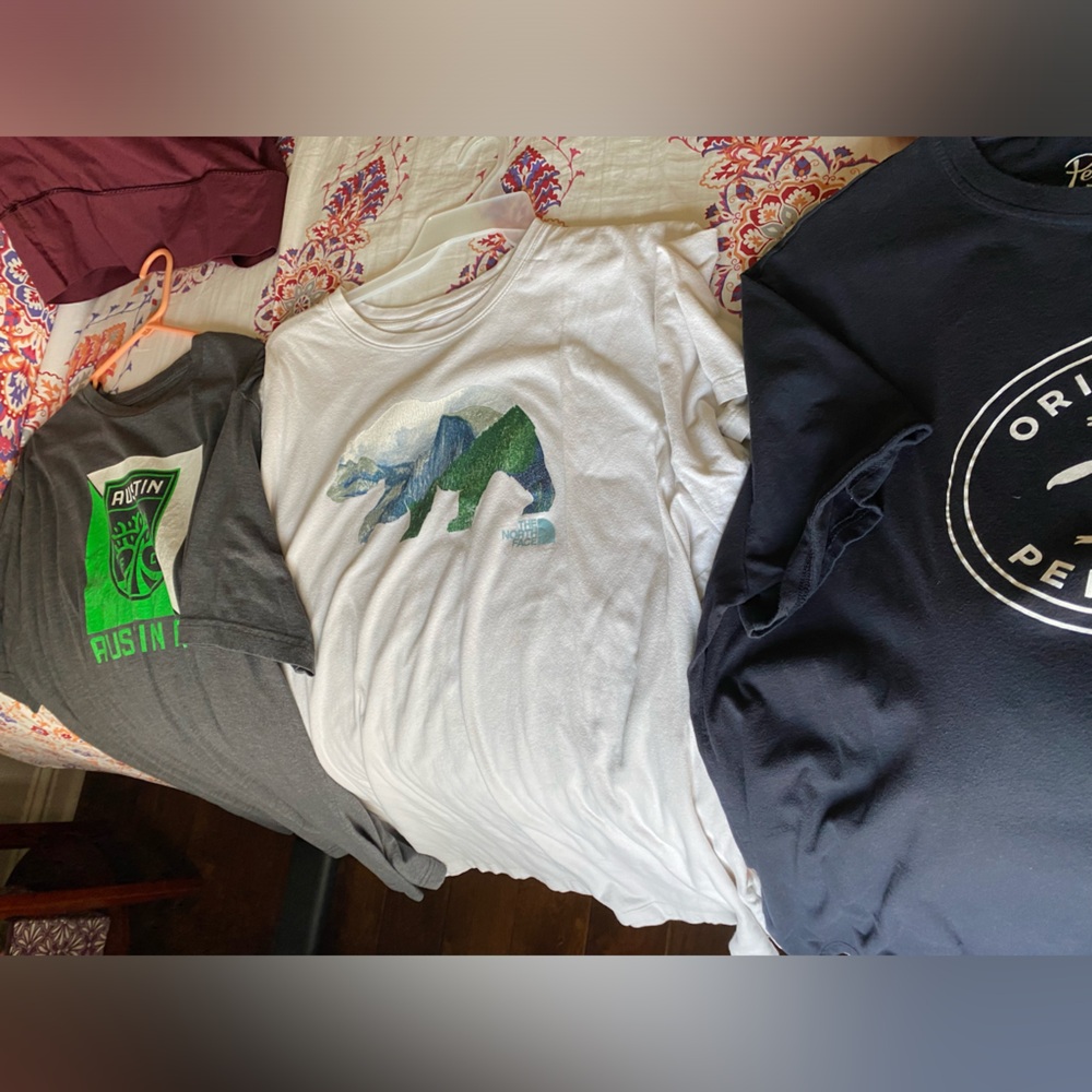 Selling a bundle of T-shirt’s one North Face, one penguin, and one Austin FC